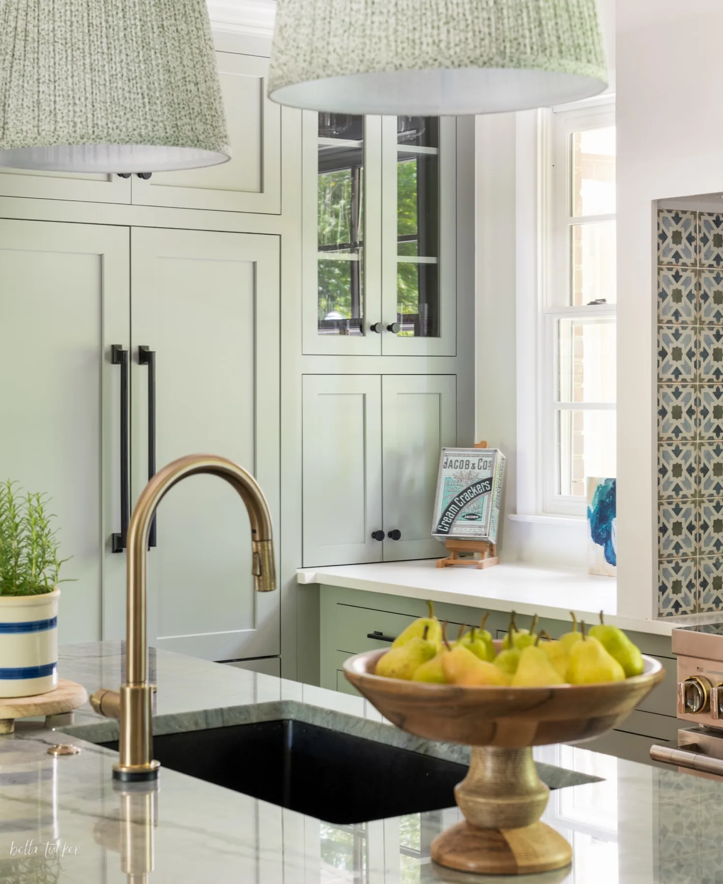 Cottage kitchen sink and faucet detail with pears