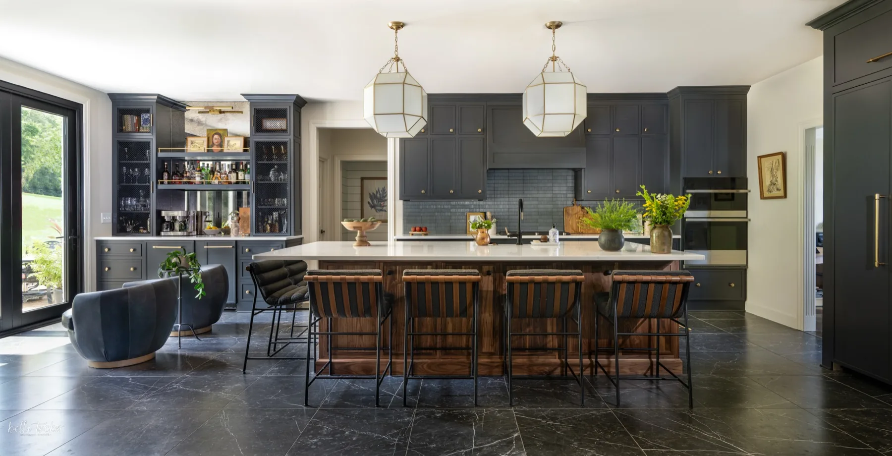 Dark and moody kitchen remodel with charcoal cabinetry