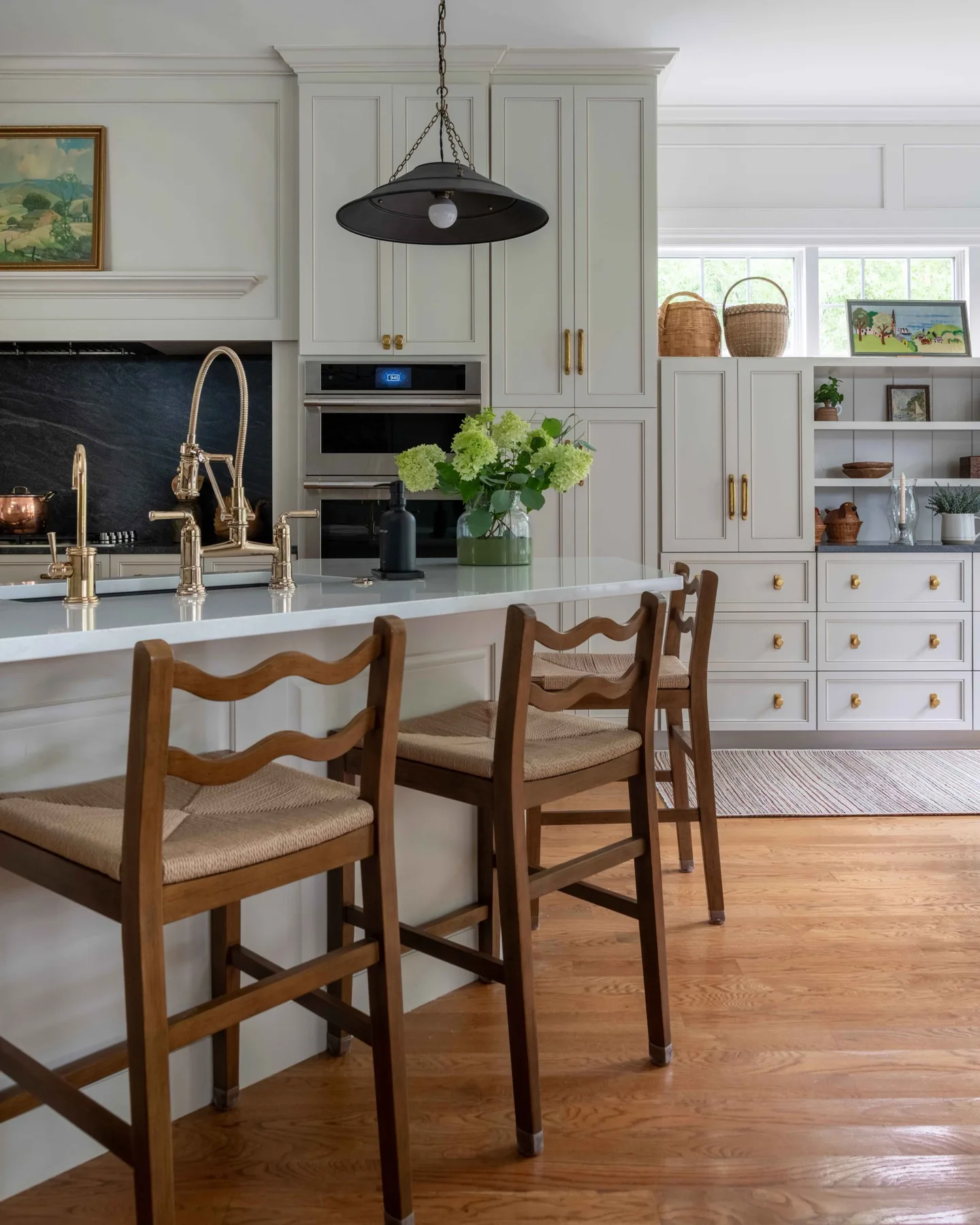 Elegant Ladd Park kitchen remodel with brass hardware and bar storage